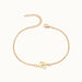 Initial Bracelet – letter N charm on a fine cable chain, gold, on ivory background