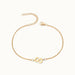 Initial Bracelet – letter S charm on a fine cable chain, gold, on ivory background