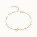 Initial Bracelet – letter T charm on a fine cable chain, gold, on ivory background