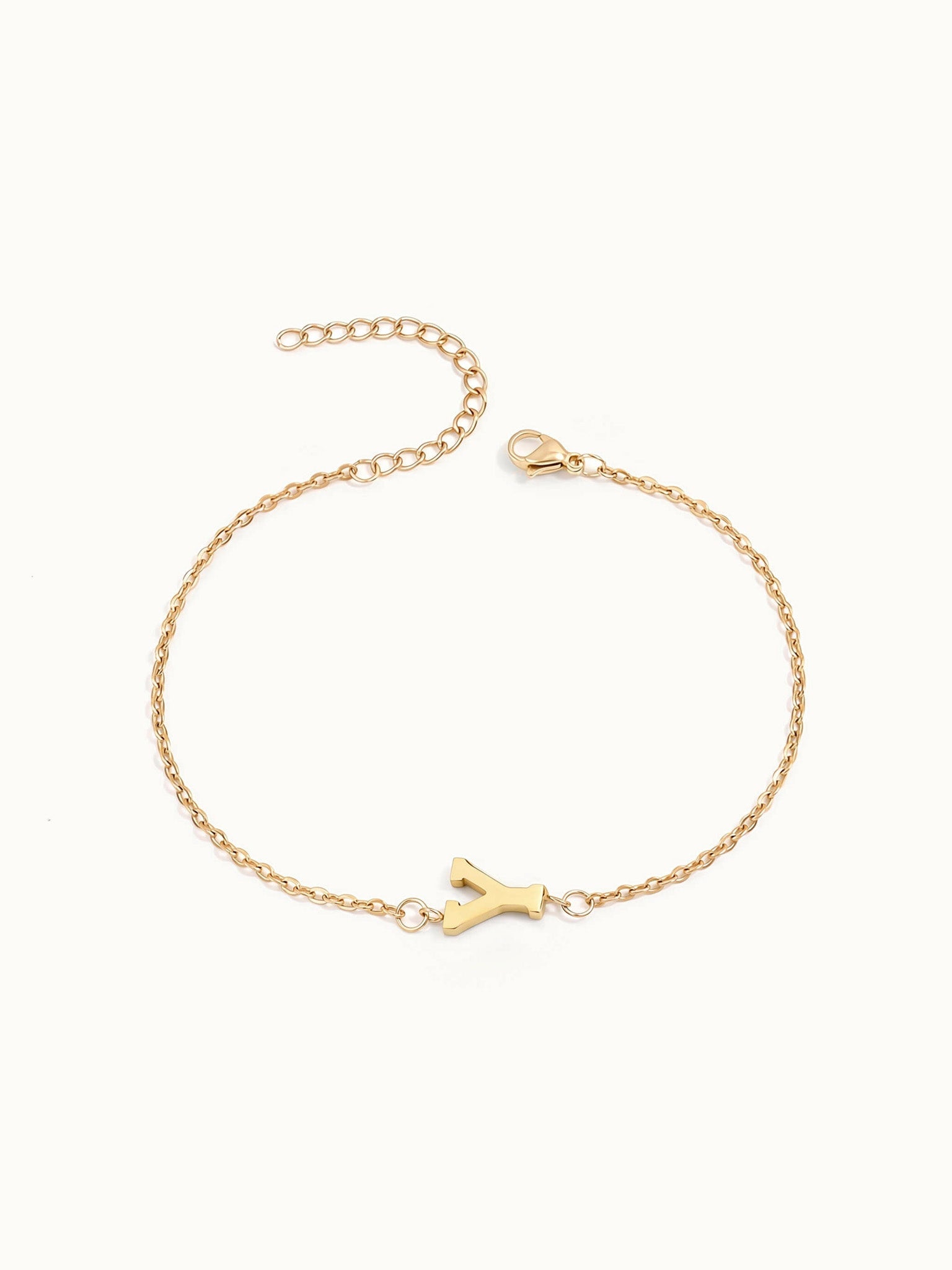 Initial Bracelet – letter Y charm on a fine cable chain, gold, on ivory background