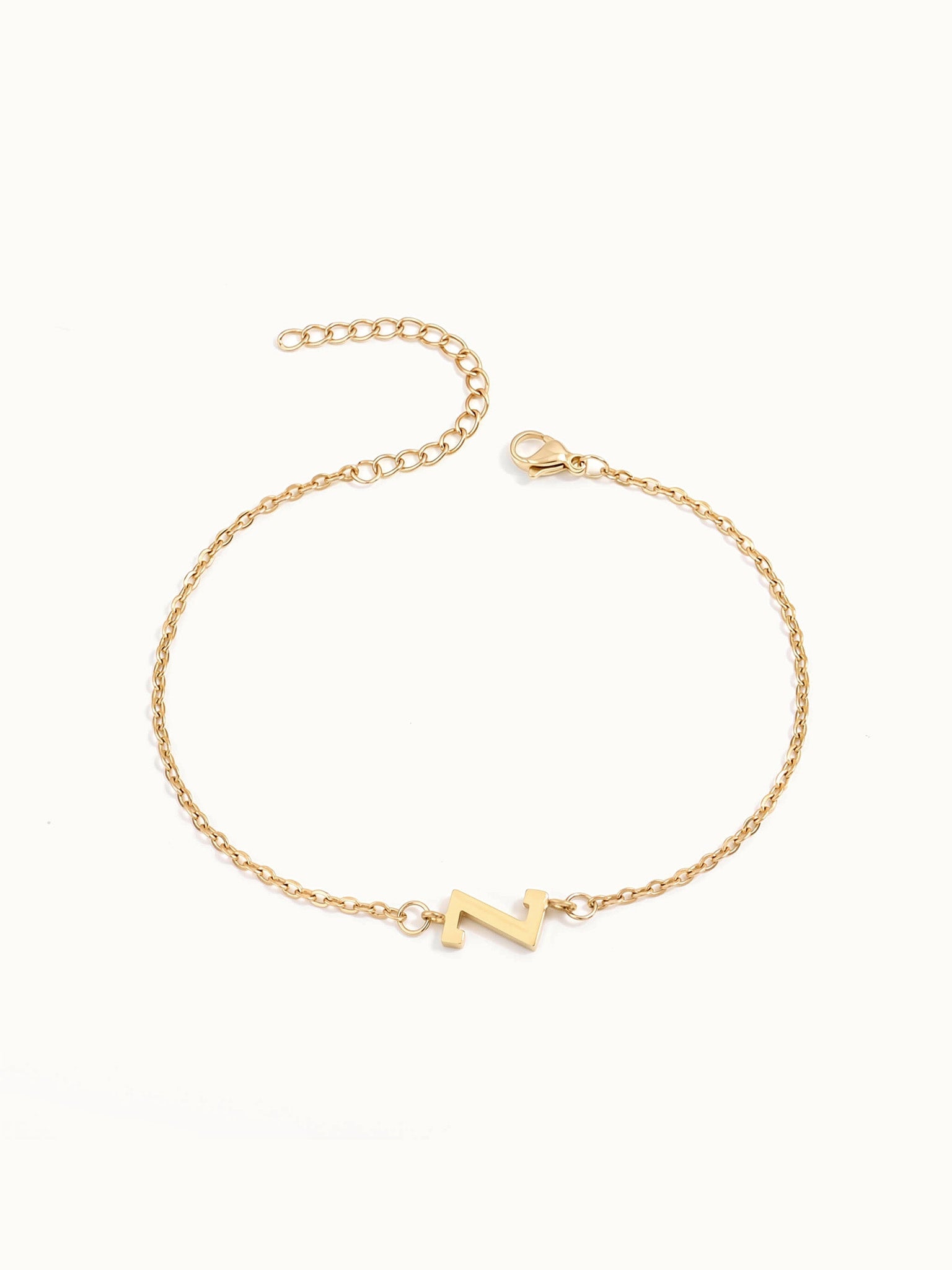 Initial Bracelet – letter Z charm on a fine cable chain, gold, on ivory background