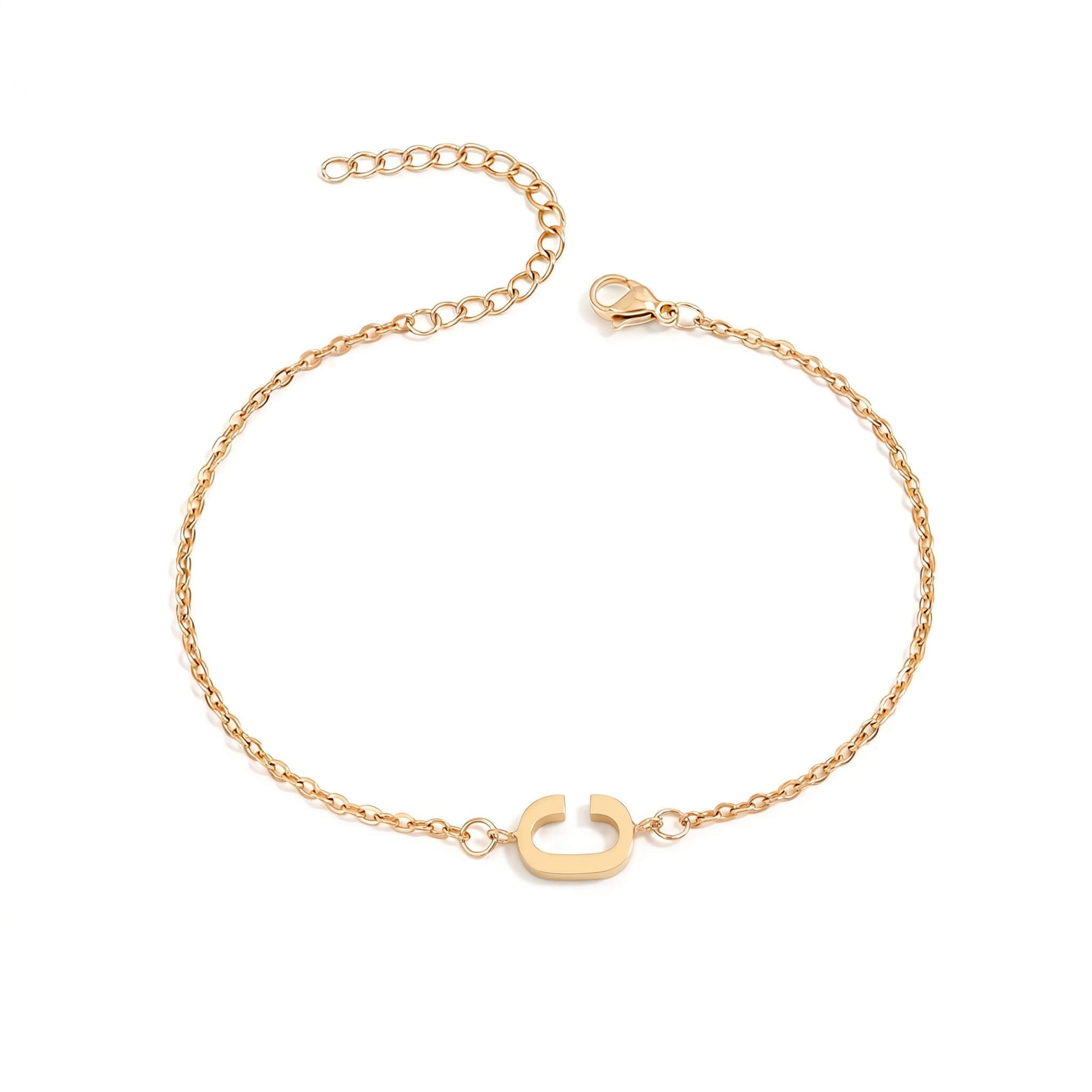 Initial Bracelet in gold with letter C charm, flat lay on white background