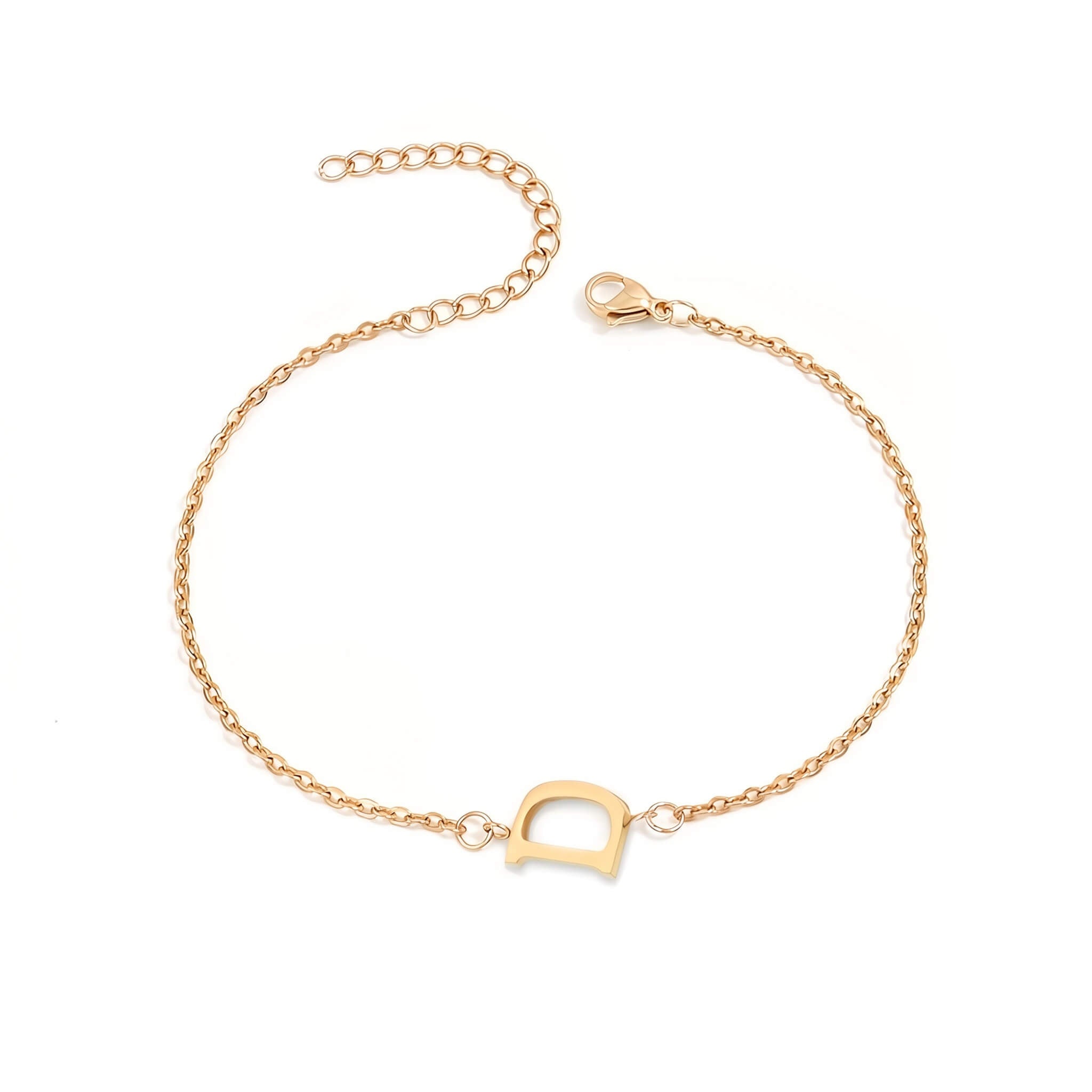 Initial Bracelet in gold with letter D charm, flat lay on white background