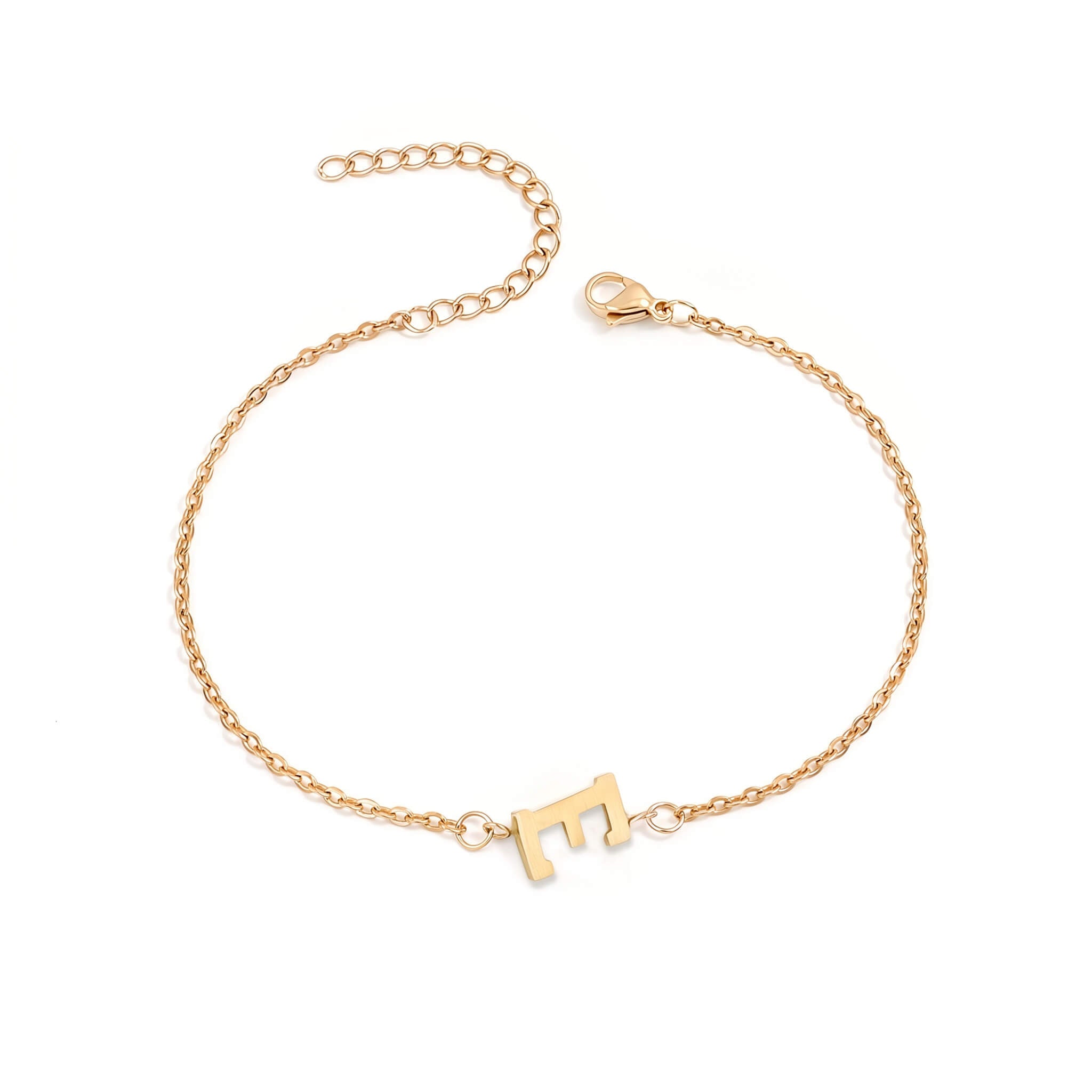 Initial Bracelet in gold with letter E charm, flat lay on white background