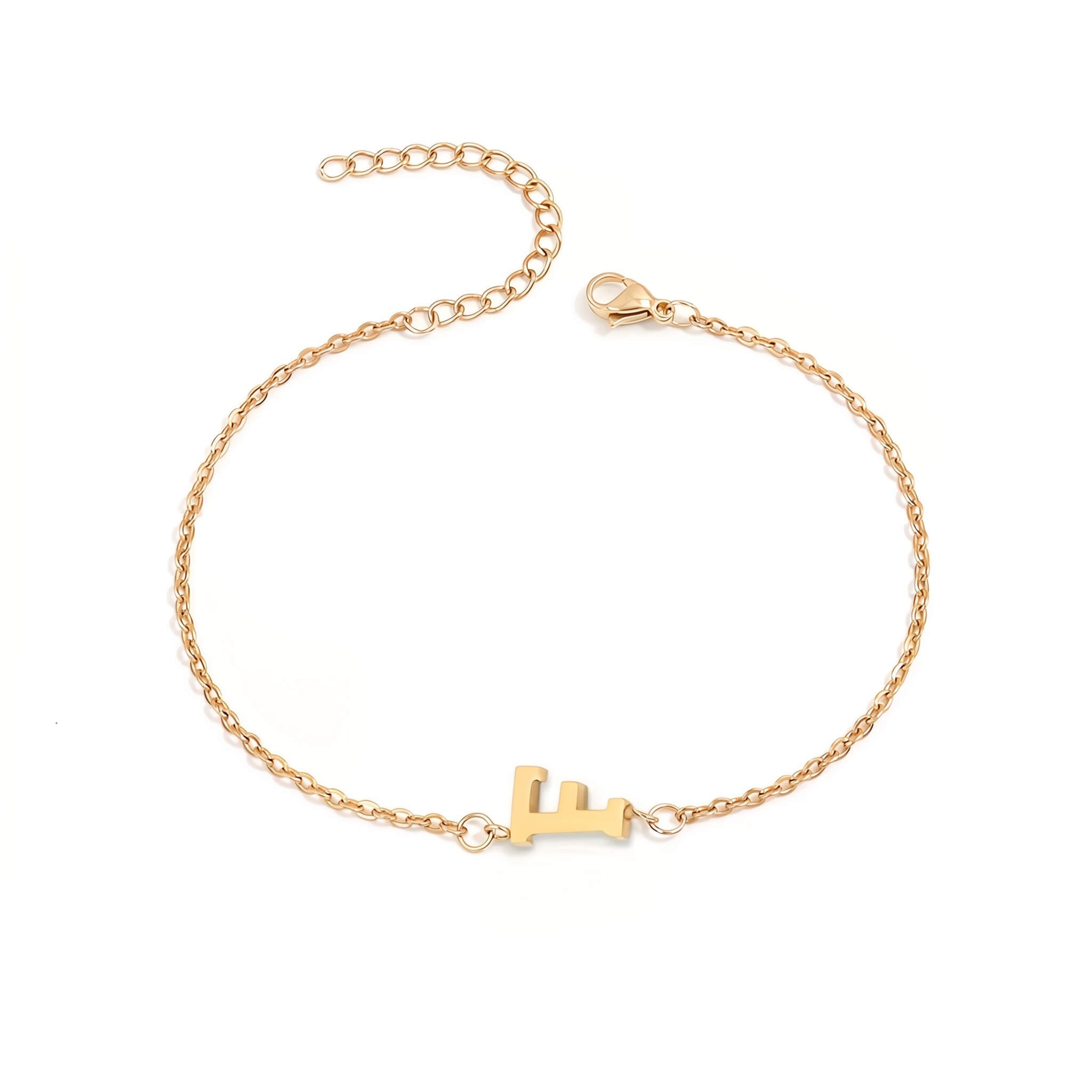 Initial Bracelet in gold with letter F charm, flat lay on white background