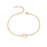 Initial Bracelet in gold with letter G charm, flat lay on white background