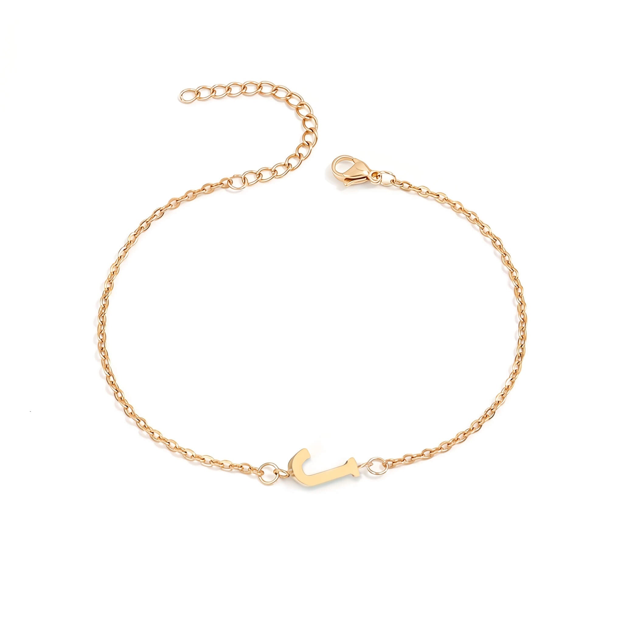 Initial Bracelet in gold with letter J charm, flat lay on white background