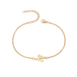 Initial Bracelet in gold with letter N charm, flat lay on white background