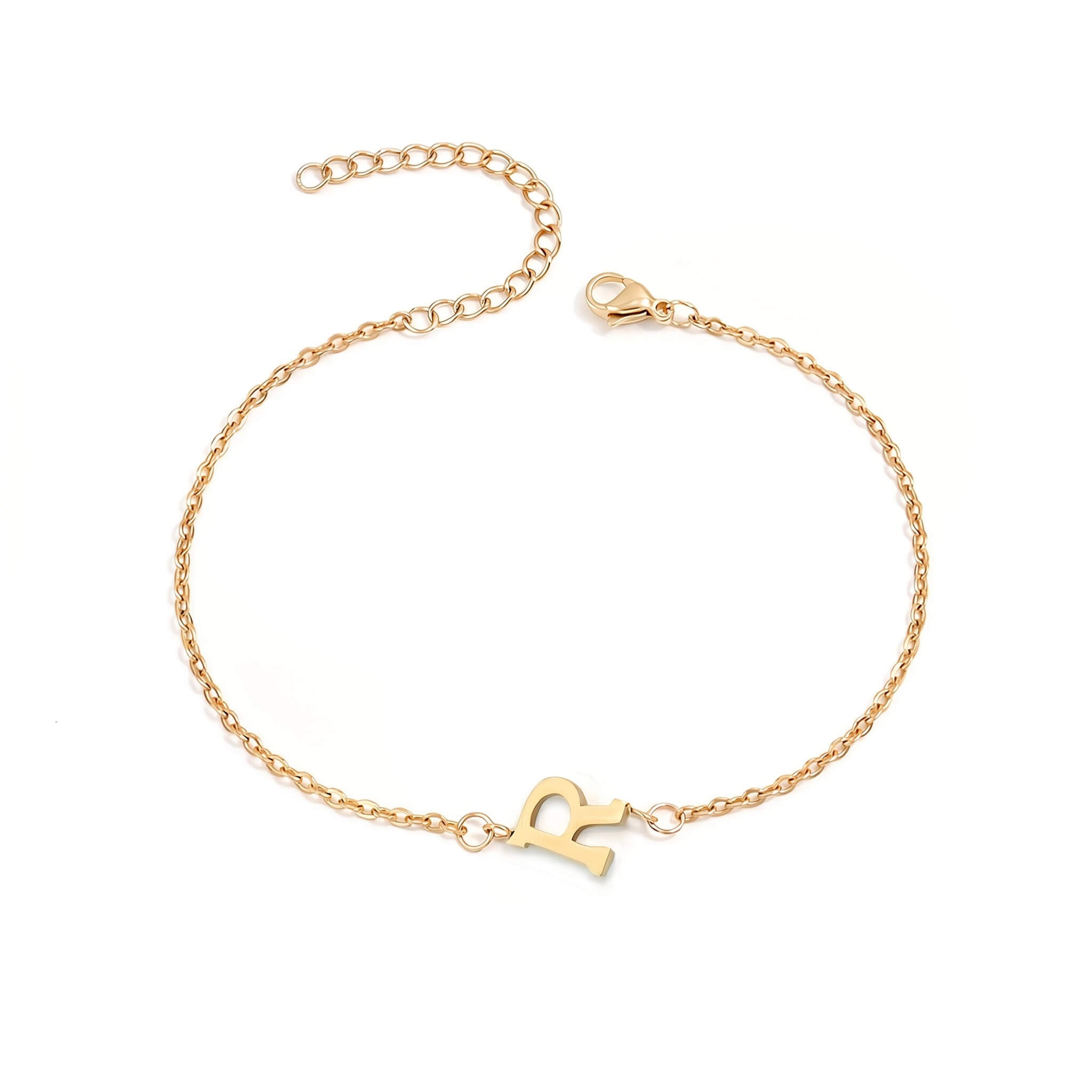 Initial Bracelet in gold with letter R charm, flat lay on white background