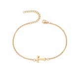 Initial Bracelet in gold with letter T charm, flat lay on white background