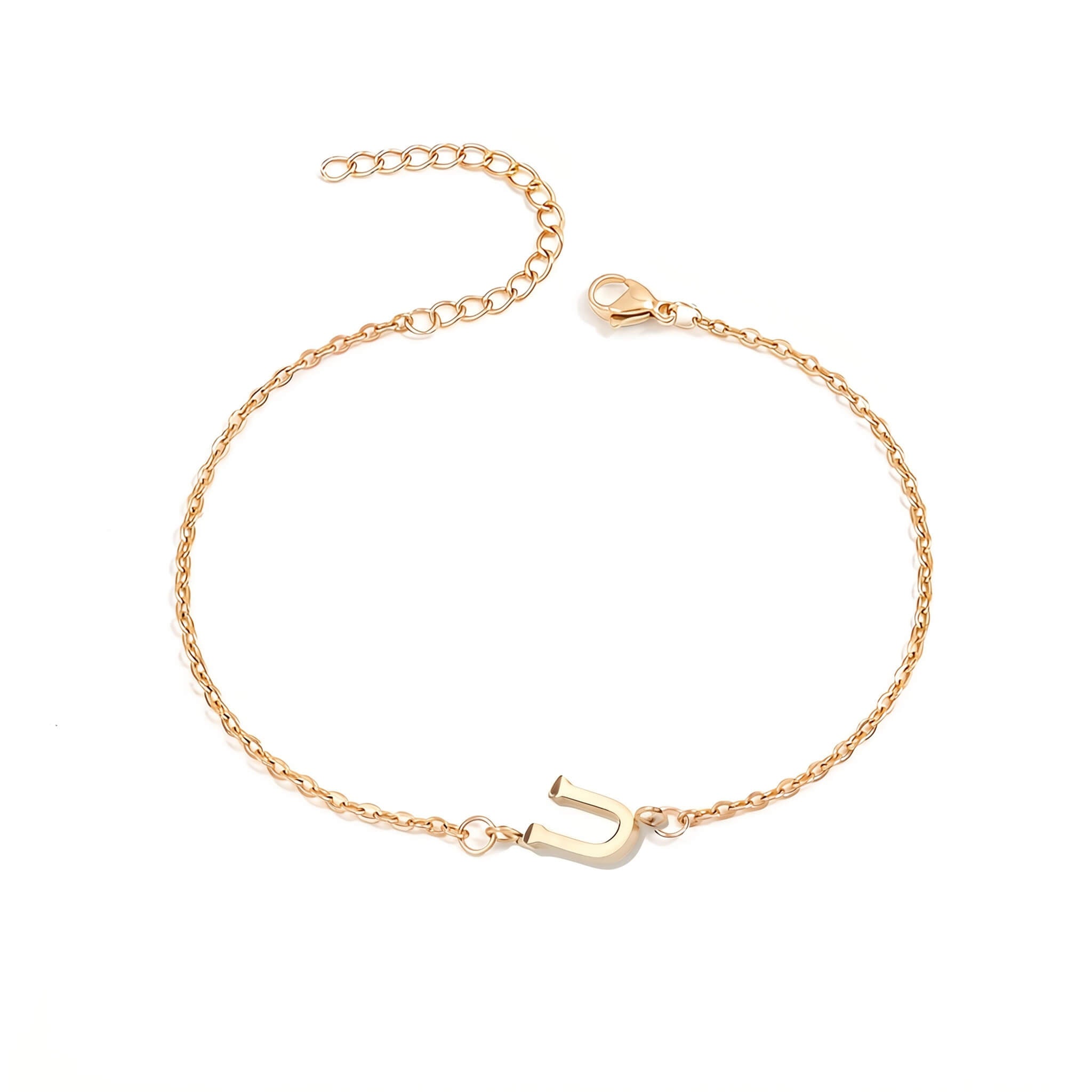 Initial Bracelet in gold with letter U charm, flat lay on white background