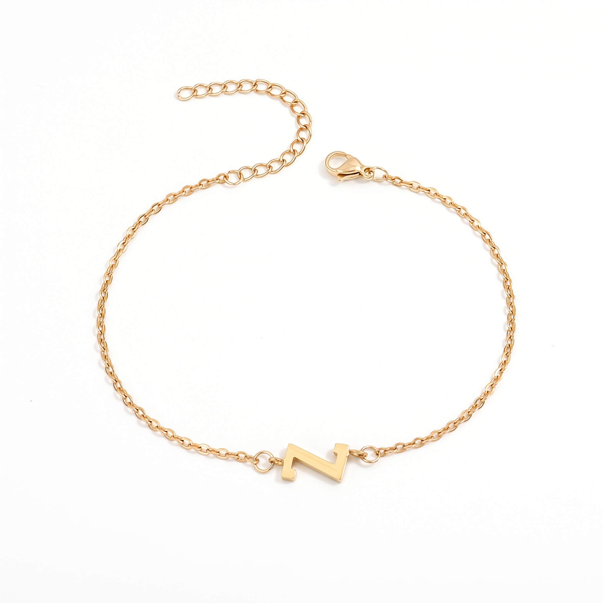 Initial Bracelet in gold with letter Z charm, flat lay on white background