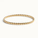 Kept Season Bangle – twisted rope-texture bangle, front view, gold, on ivory background