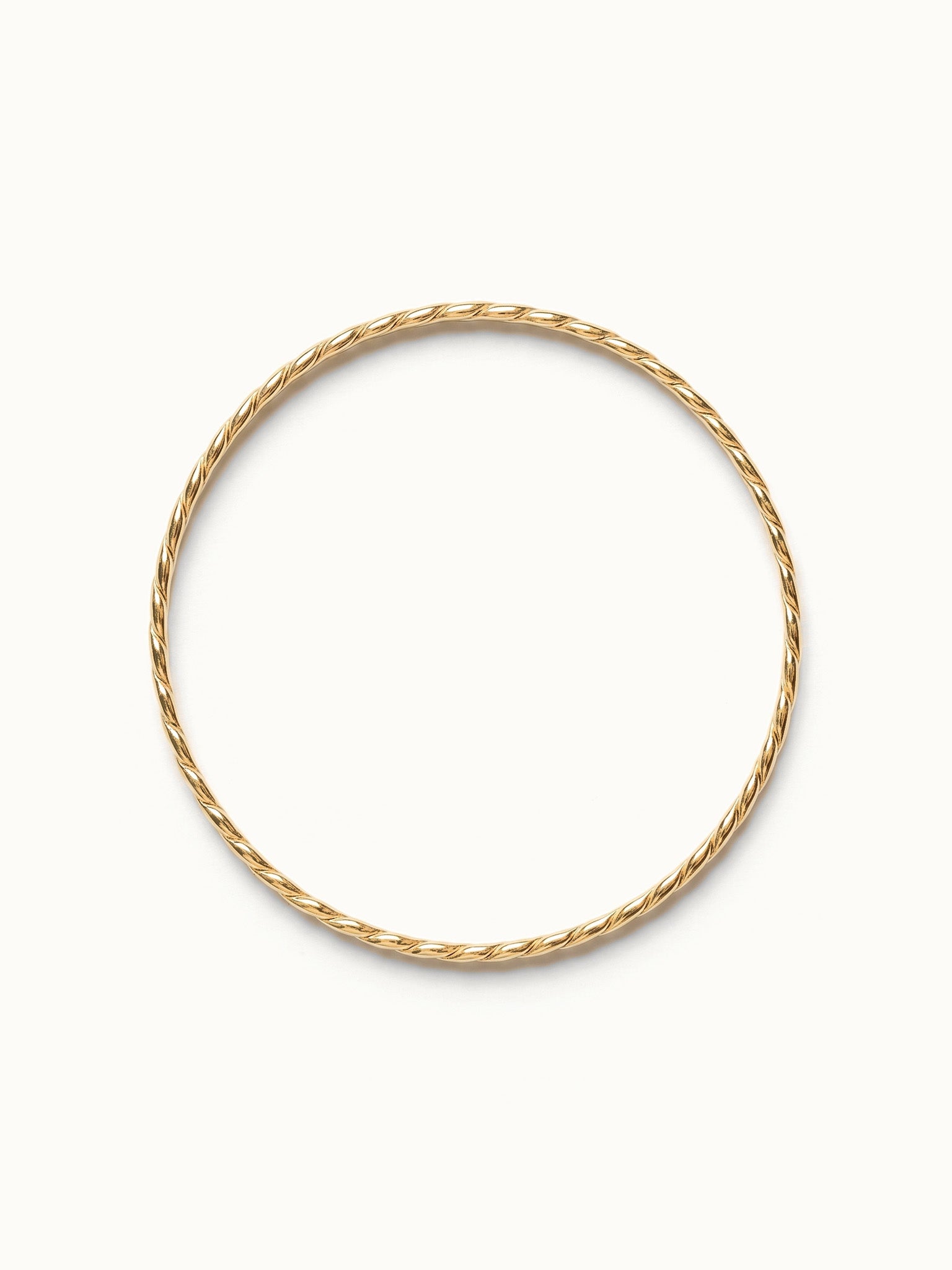 Kept Season Bangle – bangle seen from above, gold, on ivory background