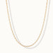 Kindred Link Necklace – link chain hanging in a U, gold, on ivory background