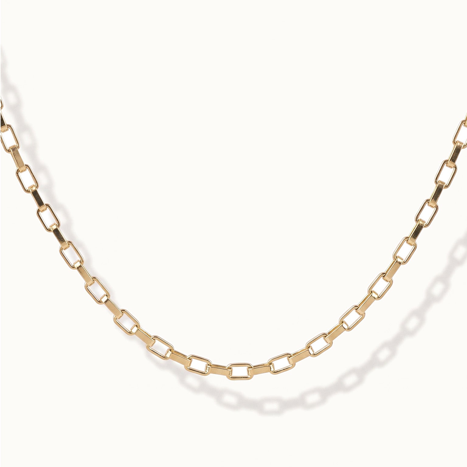 Kindred Link Necklace – close-up of the links, gold, on ivory background