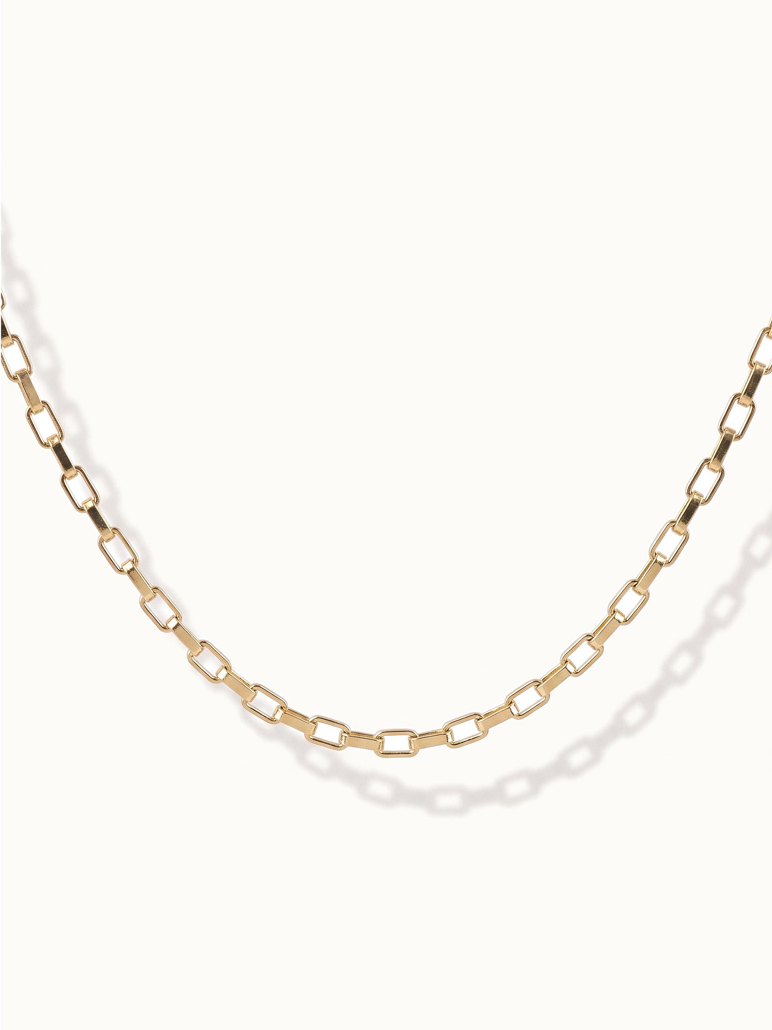 Kindred Link Necklace – close-up of the links, gold, on ivory background