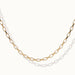 Kindred Link Necklace – close-up of the links, gold, on ivory background