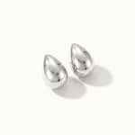 Morning Joy Studs – pair of teardrop studs, silver, on ivory background
