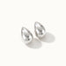 Morning Joy Studs – pair of teardrop studs, silver, on ivory background