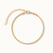 Morning Light Twist Bracelet – laid in a circle, seen from above, gold, on ivory background
