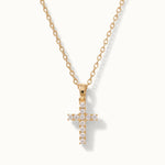 Radiant Cross Necklace in gold, hanging on a fine chain, alternative framing