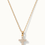 Radiant Cross Necklace in gold, hanging on a fine chain