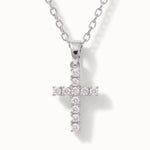 Radiant Cross Necklace in silver, close-up of the stone-set cross, alternative framing