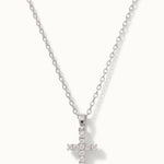 Radiant Cross Necklace in silver, hanging on a fine chain