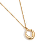 Refuge Pendant Necklace – organic loop pendant, angled close-up, gold, on white background