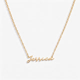 Signature Name Necklace spelling Jessica in gold script, flat lay on white background