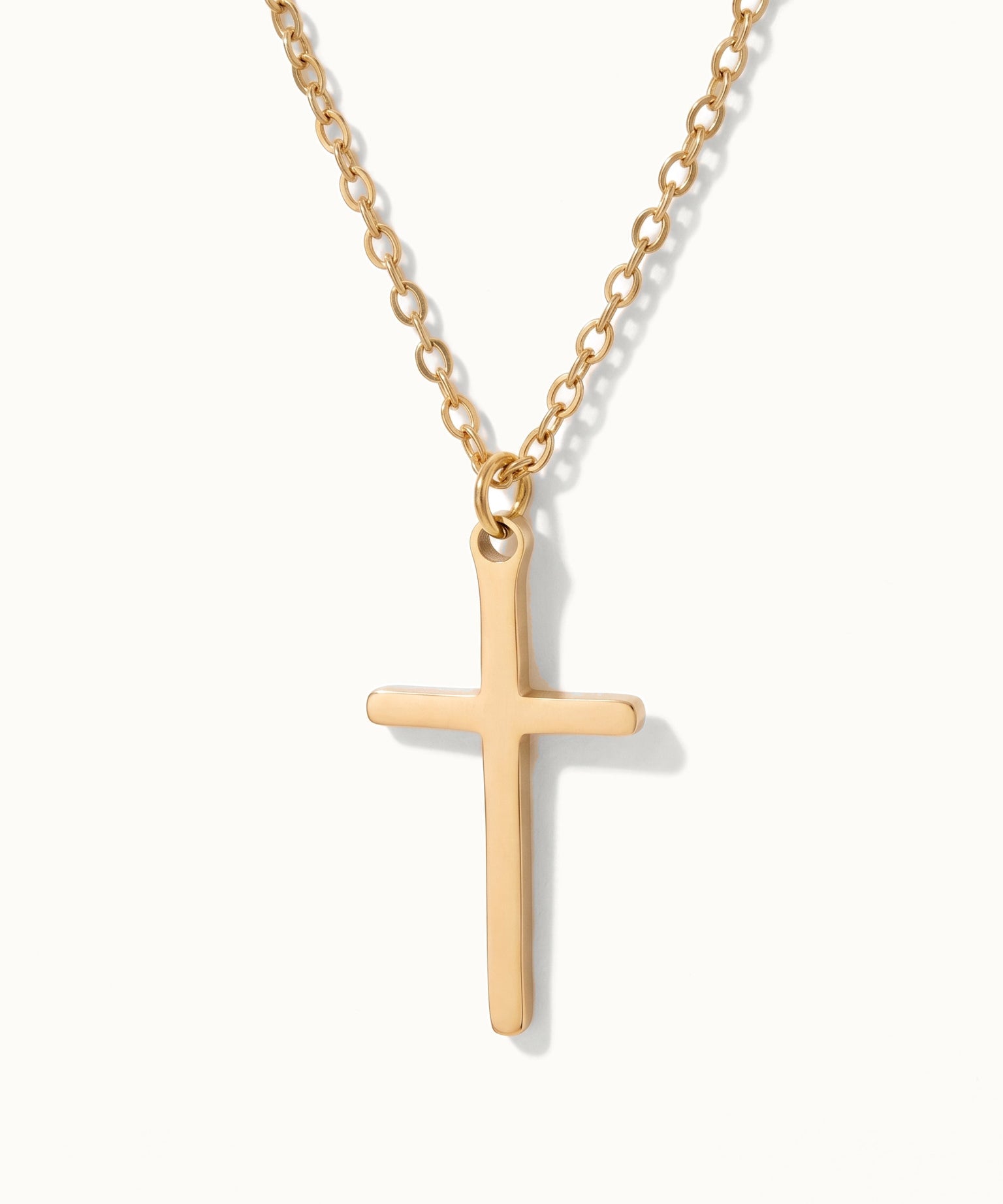 Steadfast Cross Necklace in gold, close-up of the cross