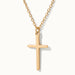 Steadfast Cross Necklace in gold, close-up of the cross