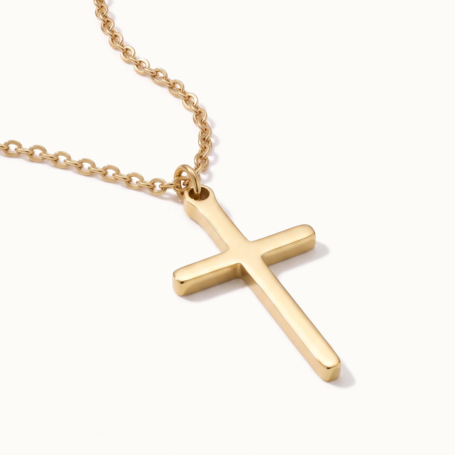 Steadfast Cross Necklace in gold, lying flat