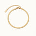 Still Waters Herringbone Bracelet – laid in a circle, seen from above, gold, on ivory background