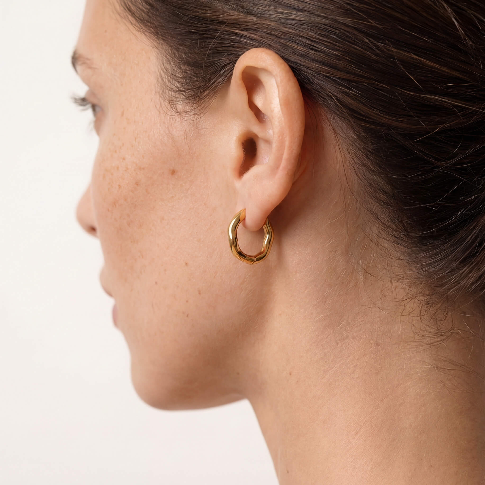 Sunday Hoops – worn in the ear, side profile, gold, hair tied back