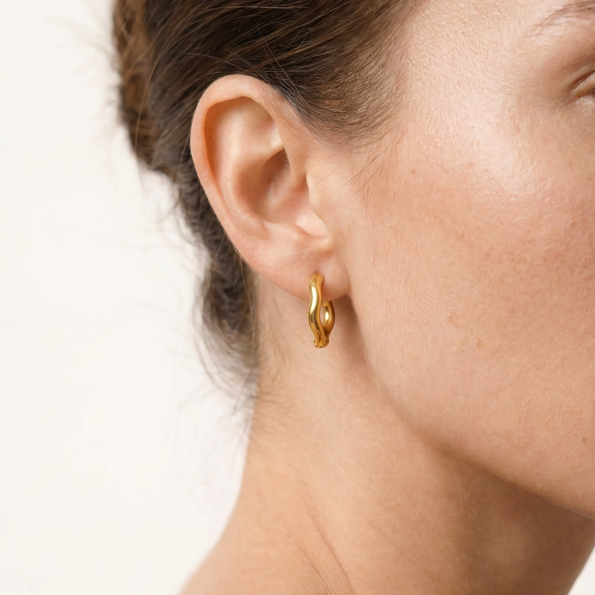 Sunday Hoops – worn in the ear, close-up, gold, hair tucked back