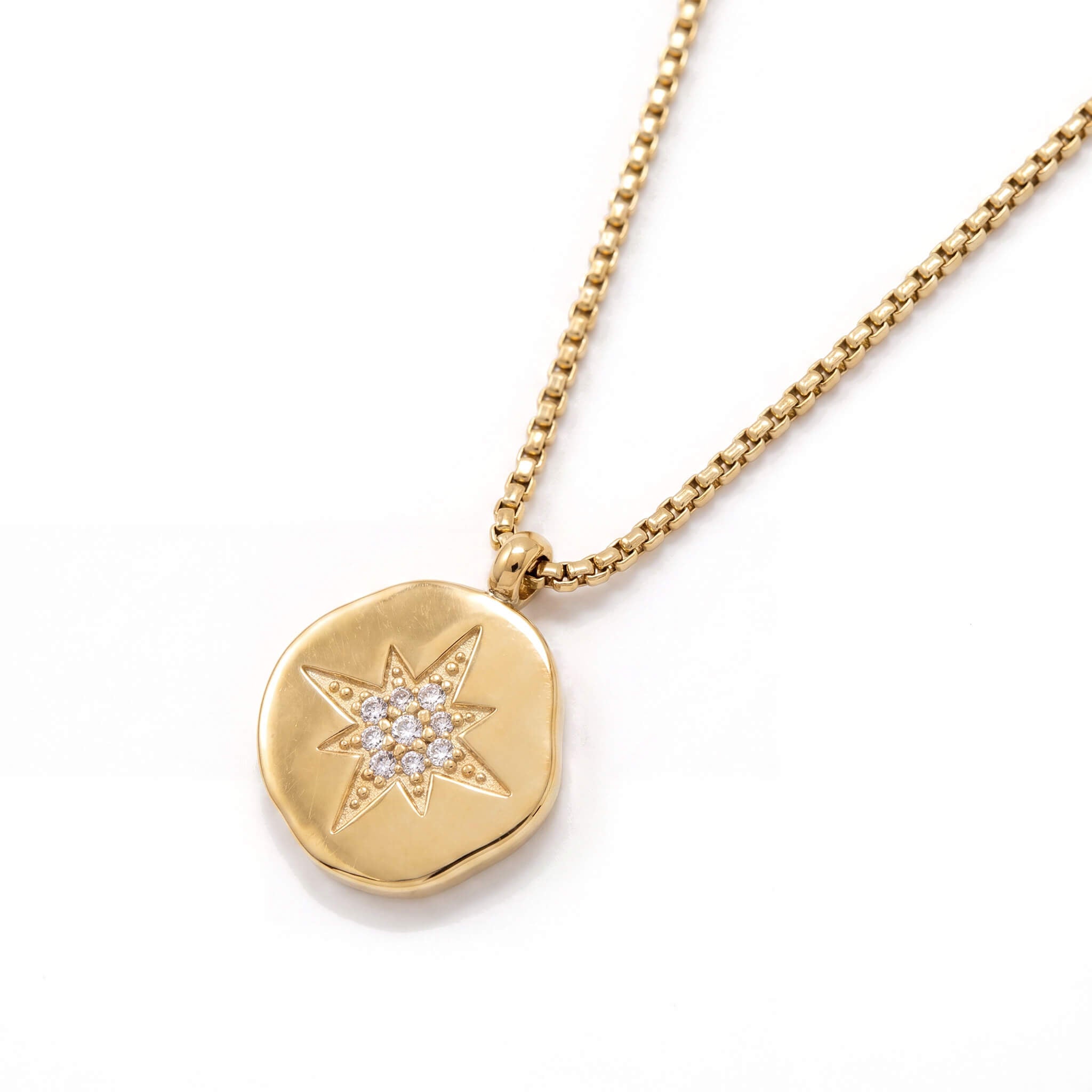 True North Necklace in gold with a textured coin pendant and star detail