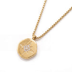 True North Necklace – star-compass medallion on a box chain, gold, on white background