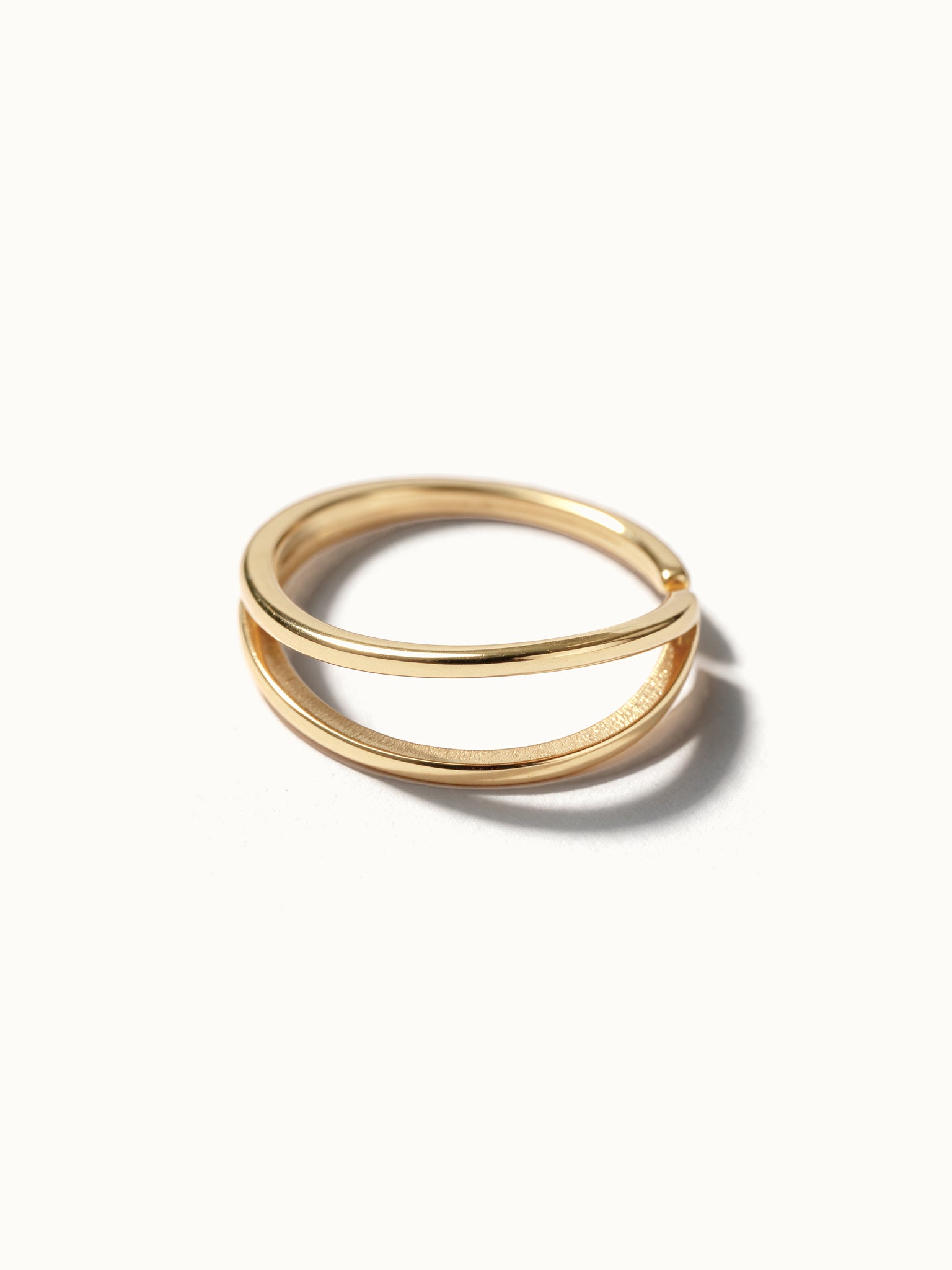 Two Paths Ring – two parallel bands, angled view, gold, on ivory background
