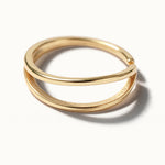 Two Paths Ring – close-up of the two parallel bands, gold, on ivory background
