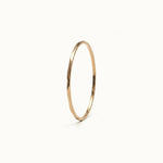 Whisper Band – 45° view, gold, on ivory background