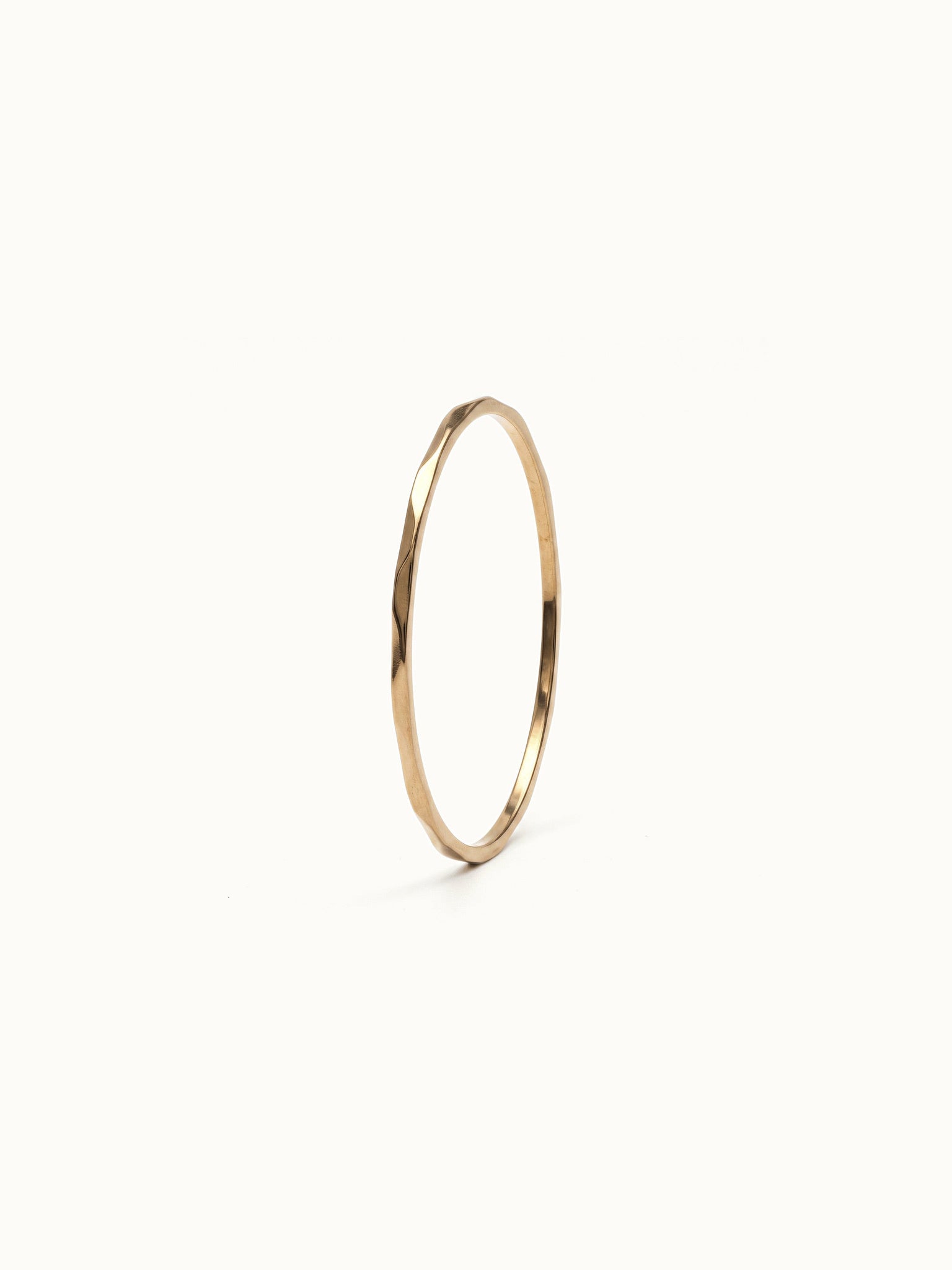 Whisper Band – 45° view, gold, on ivory background