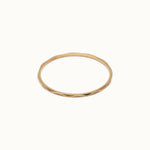 Whisper Band – flat 45° view, gold, on ivory background