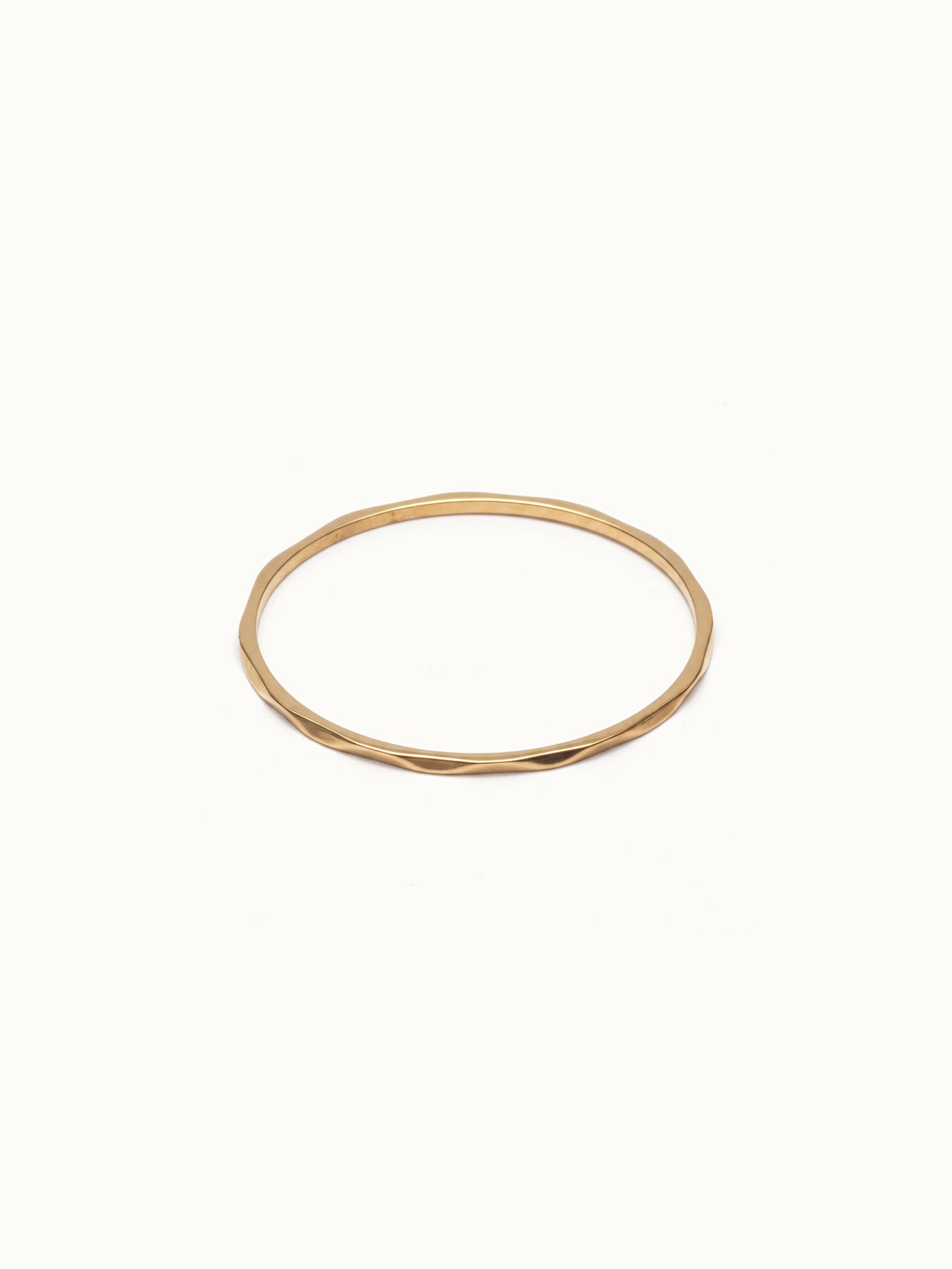 Whisper Band – flat 45° view, gold, on ivory background