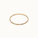 Whisper Band Ring – flat 45° view, gold, on ivory background