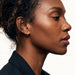 Whisper Hoops – worn in the ear, side profile, gold, curly hair up