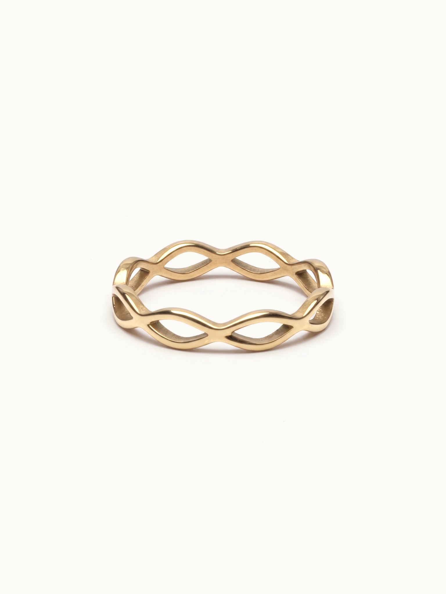 Woven Eternity Ring – flat 45° view, gold, on ivory background