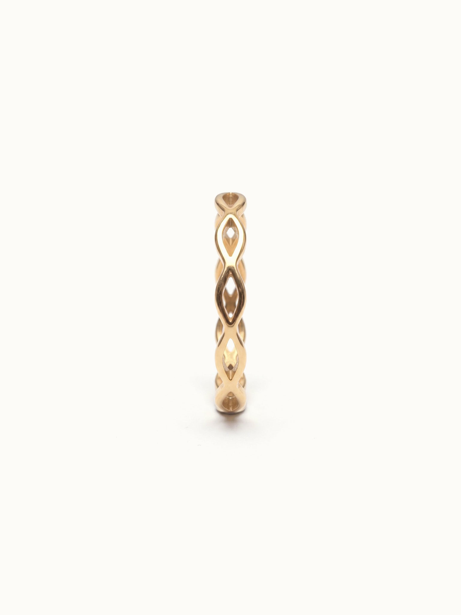 Woven Eternity Ring – front view, gold, on ivory background