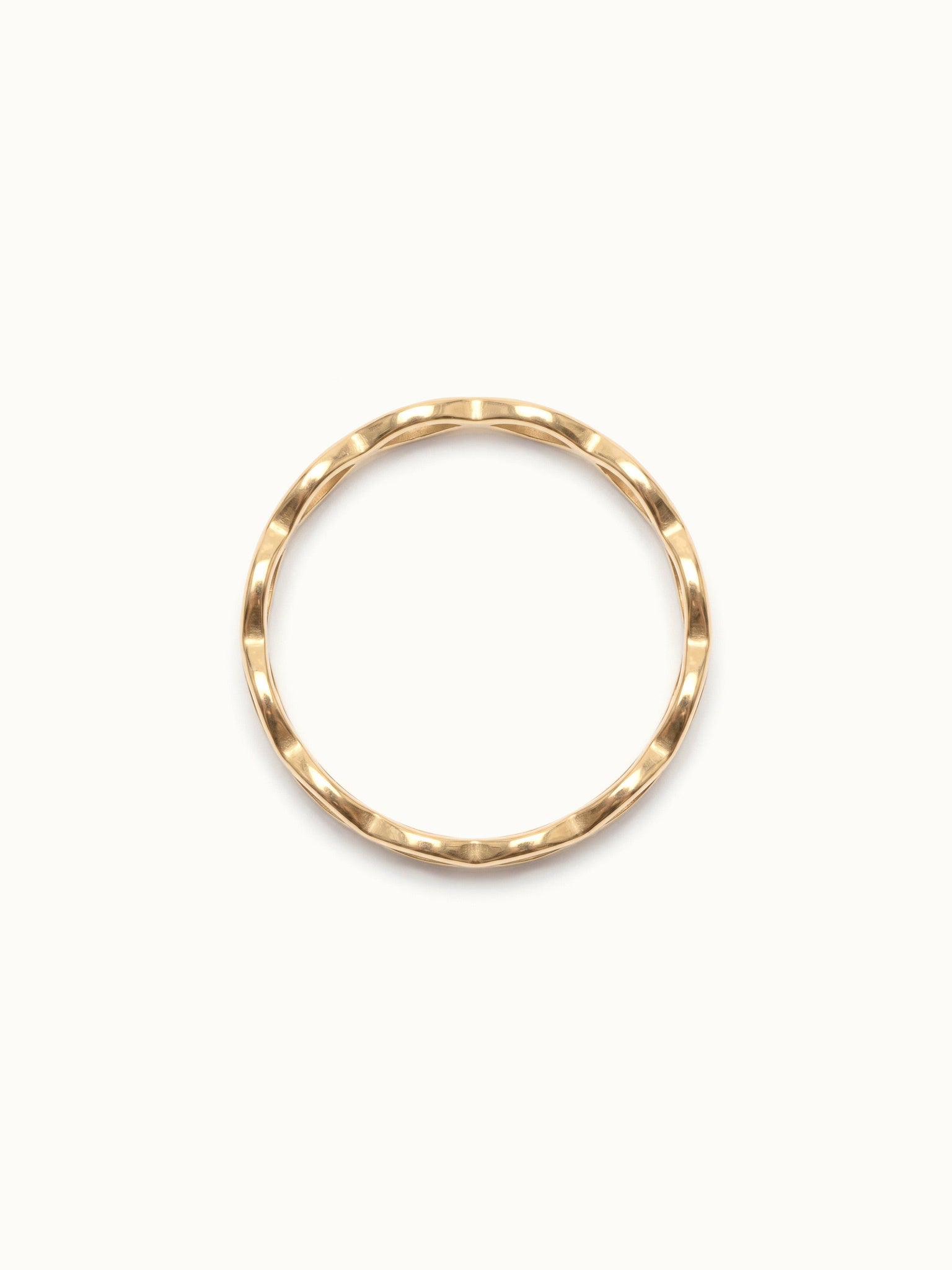 Woven Eternity Ring – side view, gold, on ivory background